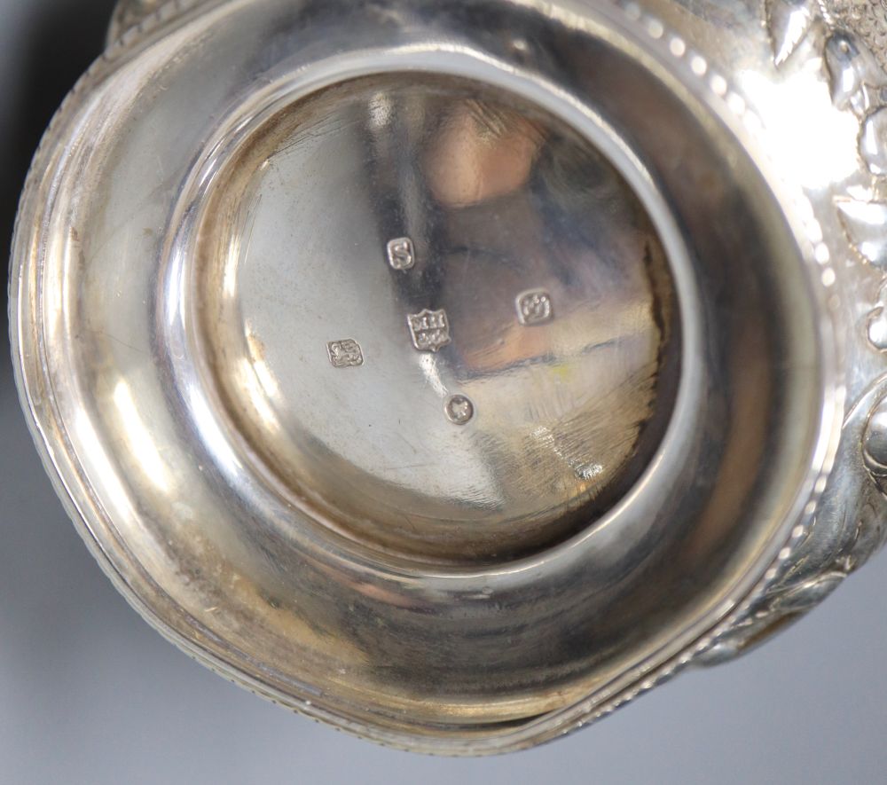 A Victorian embossed silver milk jug, Sheffield, 1860 and a silver salver, London, 1857, 27.5cm, 26oz.